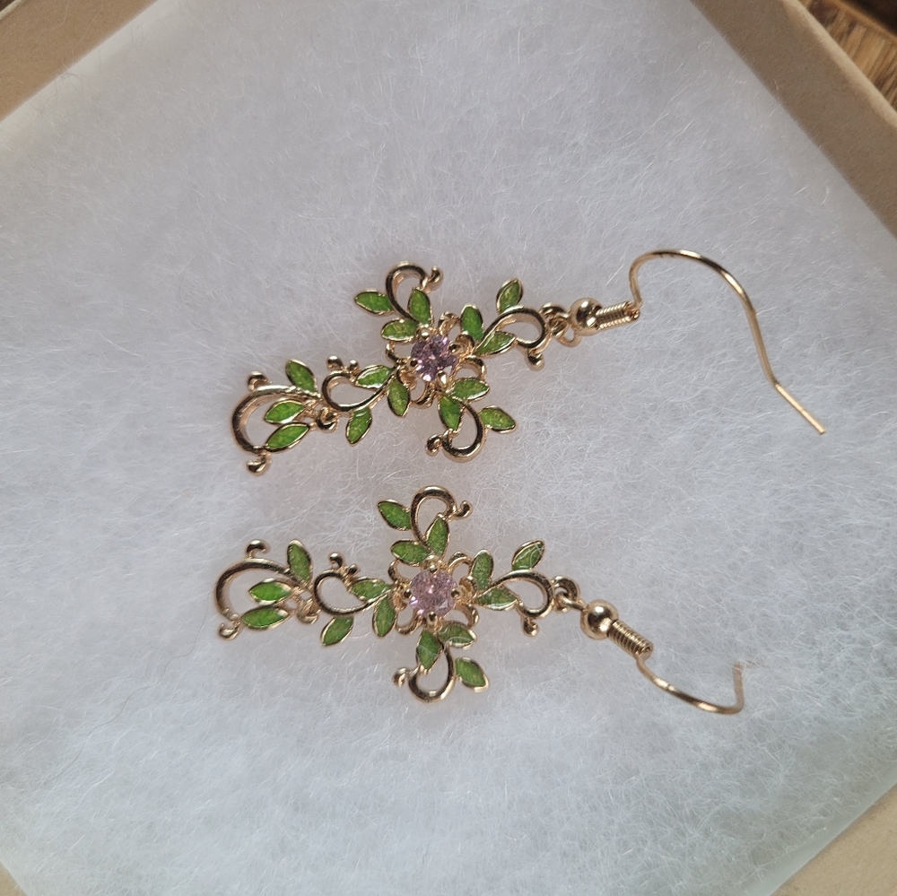 Gold earrings cross leaves